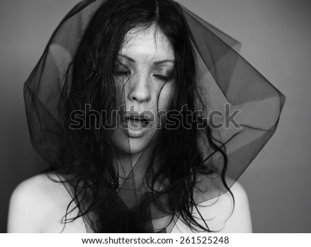 Emotions. Black veil woman. Black voile lady. Brunette girl. Portrait face white young woman