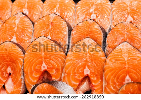 Fresh raw salmon on ice. Big pieces raw salmon. Fish on ice. Salmon on counter. Fresh fish