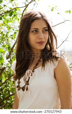 country woman in spring summer day. Summer sun. Spring mood.  Summer wind. Summer sky. Fashion style model. Flowers spring. bloom