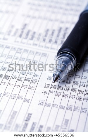 stocks and shares with a pen