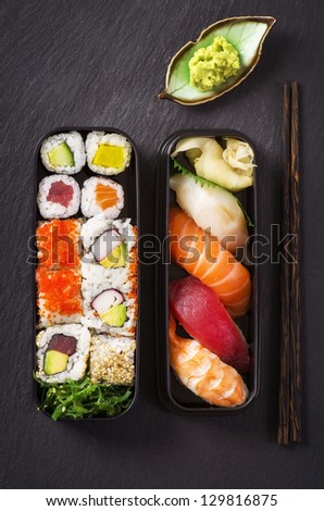 bento box with sushi and rolls