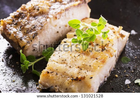 fish fillet fried in the pan