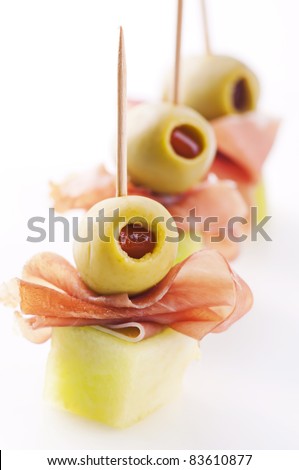 canapes with ham and pickled olives