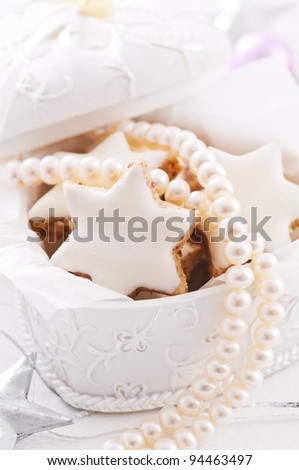 Present box with sweets and pearl necklace
