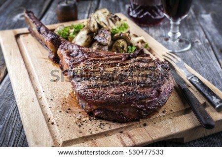 Barbecue Tomahawk Steak on Cutting Board