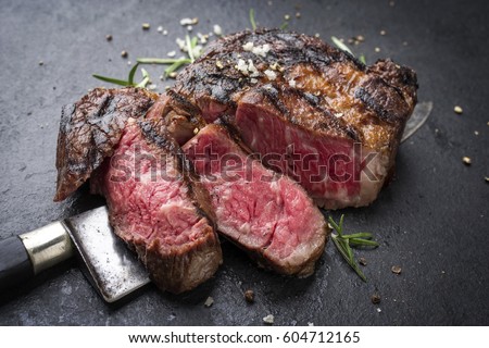 Barbecue aged Wagyu Rib Eye Steak as close-up on slate