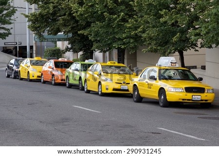SEATTLE - JUNE 24, 2015 - Line of taxi cabs outside of the Renaissance Hotel in downtown Seattle. This lineup is typical of what can be seen outside of this hotel.