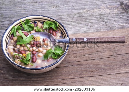Red bean, white bean, urid bean and chick pea soup with fresh coriander leaves.