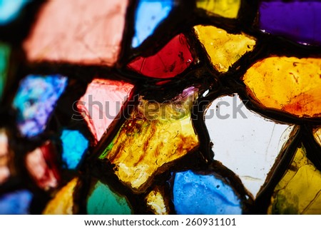Fragment of broken and discarded color stained-glass window. Objects from junk-yards.