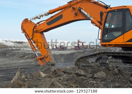 Production useful minerals, mining operations, ore loading, kovshovy excavator,