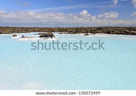 Geothermal water pool near Blue Lagoon - Blue Lagoon is one of the most visited attractions in Iceland. The steamy waters are part of a lava formation. It is located in a lava field near Reykjavik