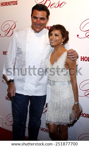 Chef Todd English and actress Eva Longoria Parker arrive to the opening of Beso Restaurant held at the Beso in Hollywood, California, United States on March 6, 2008.