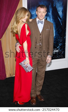 Jacqui Ainsley and director Guy Ritchie at the Los Angeles Premiere of \