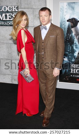 December 6, 2011. Jacqui Ainsley and Guy Ritchie at the Los Angeles premiere of \