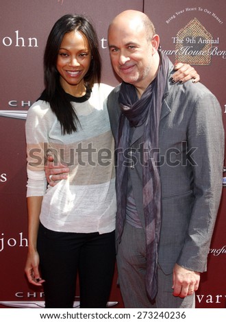 Zoe Saldana and John Varvatos at the 9th Annual John Varvatos Stuart House Benefit held at the Varvatos Store in West Hollywood on March 11, 2012.