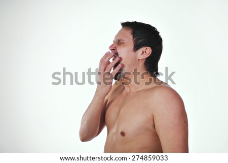 a naked man wakes up on a white background