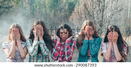 Girls on the background of wood smoke, the sun smiles