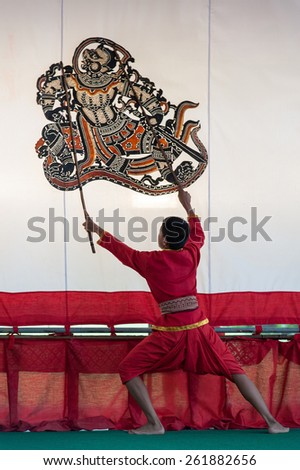 RATCHABURI, THAILAND - AUGUST 20: Unidentified puppeteer performs with his shadow puppet on the stage at Wat Khanon on August 20, 2011 in Ratchaburi, Thailand.