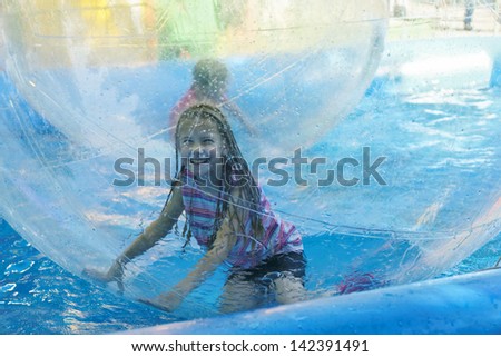 Girl on roller coaster aquazorbing
