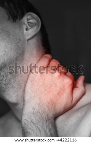 Young man having neck ache