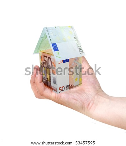 A house made from euro bills in man\'s hand