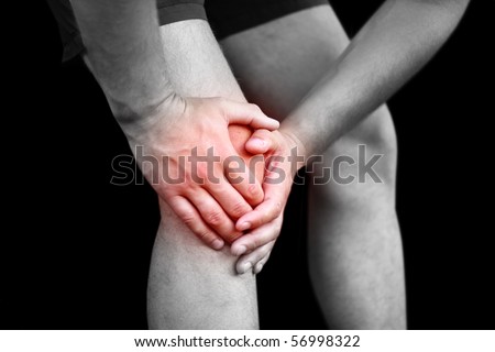 Young man having knee pain