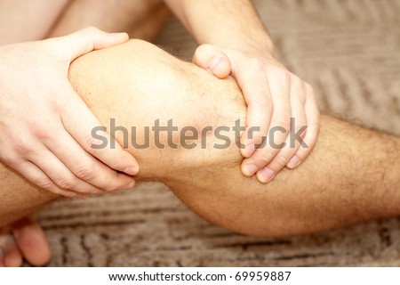 Young man having knee pain
