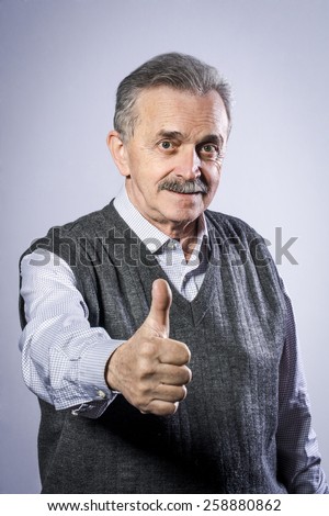 Old man showing thumbs up
