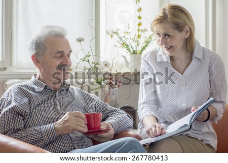 Two people with a book