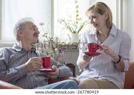 Two people with cups