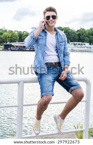 Young man outside by the river