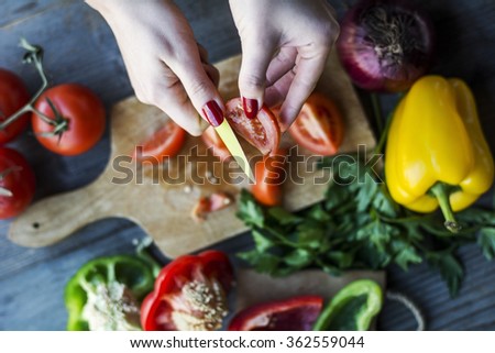 Woman\'s hands preparing a vegetarian meal