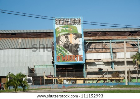 SANTA CLARA, CUBA - JULY 3: Fidel castro features on a large billboard outside and old factory outside Santa Clara, Cuba on July 3, 2012. Billboards of propaganda can be seen all around Cuba.
