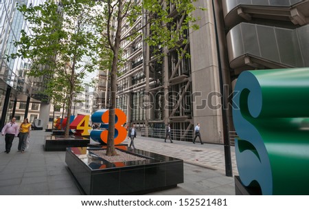 LONDON, ENGLAND - JULY 16, 2013: street art, large numerals in Lime Street, in the finance district of London, on July 16, 2013. Striking brightly coloured numbers add to the ambience of the street.