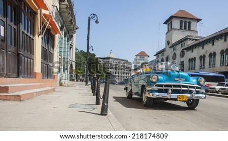 HAVANA, CUBA - JUNE 30; Bright blue 1950\'s Chevrolet classic car with iconic badge on bonnet on June 30, 2014 in Havana, Cuba. American classic cars, often well restored are popular taxis in Cuba.