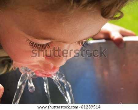 Boy at drinking fountain.