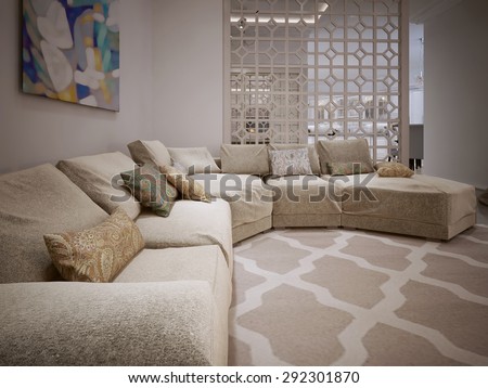 Large corner sofa in a modern style. From fabric beige cushions. Arabic ornament. 3D render.