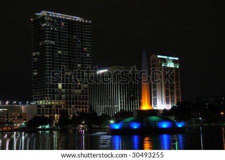 shot facing northwest corner of Lake Eola with Fountain and buildings in shot