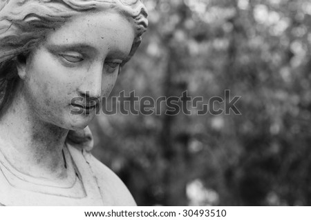 Black and white image of a melancholy looking female