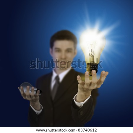 business man holding light bulb ,thinking of new idea