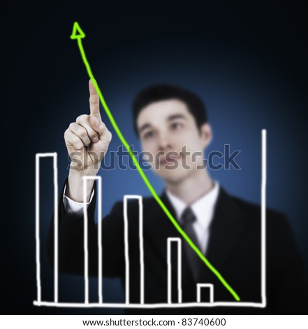 Businessman drawing a rising arrow, representing business growth