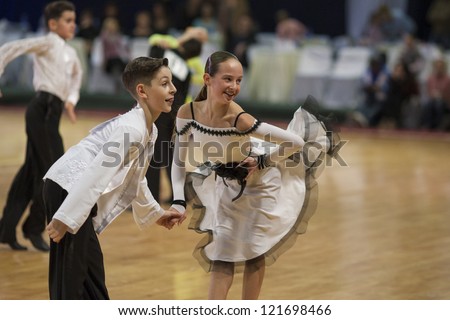 MINSK-BELARUS, NOVEMBER, 24: Unidentified Dance couple performs Juvenile-2 Latin-American program on BELARUS OPEN Minsk 2012 WDSF championship, November 24, 2012 in Minsk, Belarus