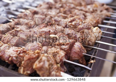 roasted chicken meat on skewer outdoors.national food