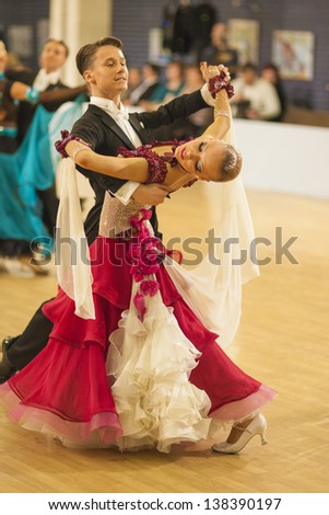 MINSK-BELARUS, APRIL, 7: Unidentified Dance couple performs Youth-2 standard program on BELAYA RUS\' championship in April 7, 2013 in Minsk