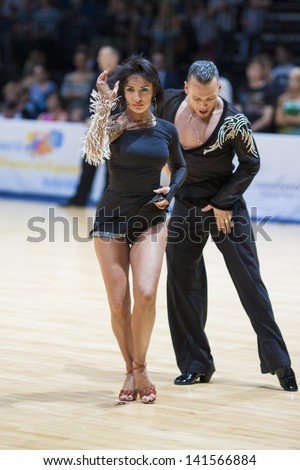 MINSK-BELARUS, MAY, 18: Unidentified Dance couple performs ADULT Latin-American program on World Open Minsk-2013  championship in May 18, 2013 in Minsk, Republic Of Belarus