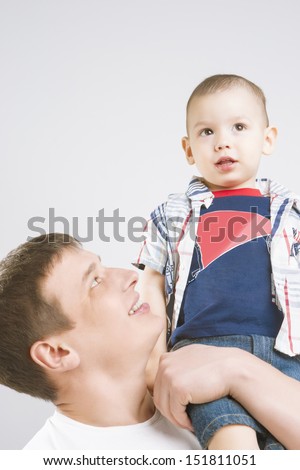 Father and Son together having fun and smiling. vertical image