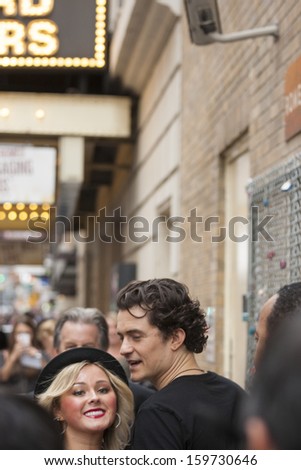 NEW-YORK, USA - OCTOBER 9: Orlando Bloom accompanied young blond lady prior to ROMEO AND JULIET performance at Richard Rogers Theater, October 9, 2013, New York, United States