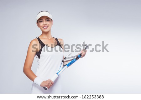 Portrait of Young Smiling Woman With Tennis Racket Isolated on White Background. Horizontal Image
