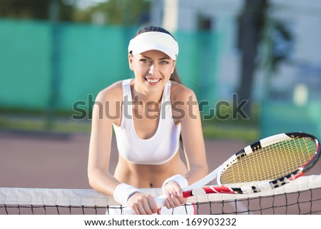 Young Caucasian Professional Female Tennis Player Near Tennis Net. Horizontal Image