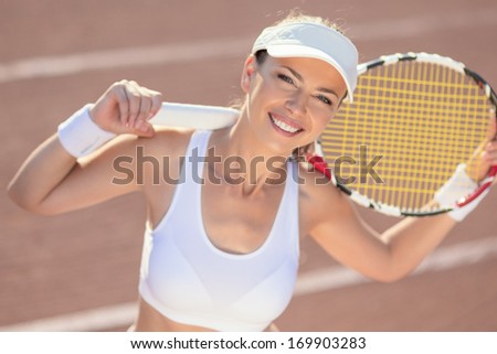 Portrait of Happy Smiling Female Tennis Athlete Outdoors. Horizontal Image